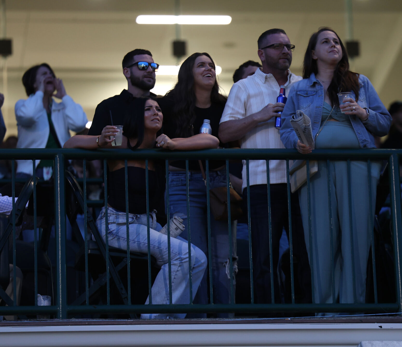 Group of people watch races at Opening Night.JPG